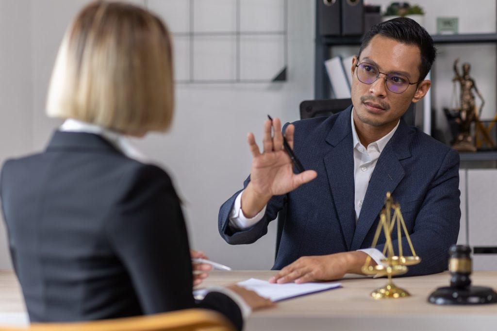 Business Asian people and lawyers, Businessman and lawyer discuss the contract document. Judge gavel