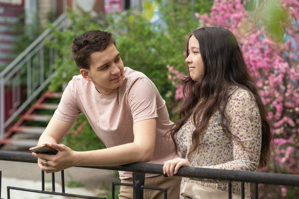 Happy couple talking on the street